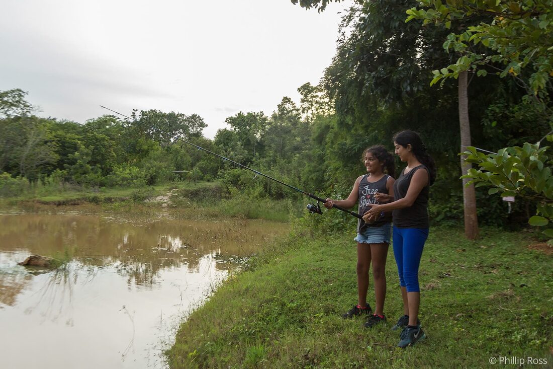 A mother and daughter enjoying a bonding session while also learning about responsible angling on our Mother & Child Nature Camp to Bannerghatta near Bangalore