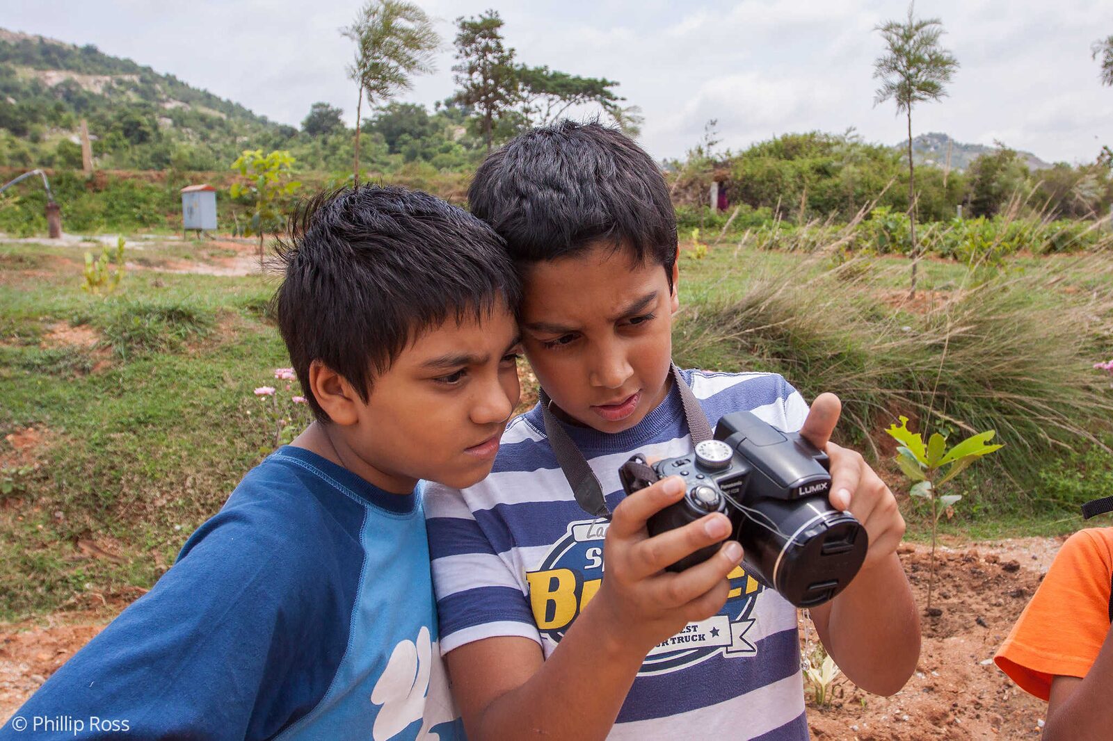 Kids reviewing their photos to see what to improve on our Kids Photography Workshop in Bangalore
