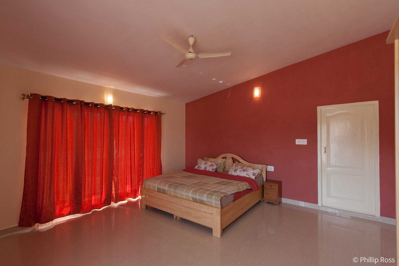 A luxury guest room at The Outback Farm and Homestay, built out over the lake
