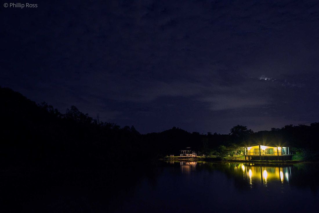 The Outback Farm and Homestay lit at night under a clear sky