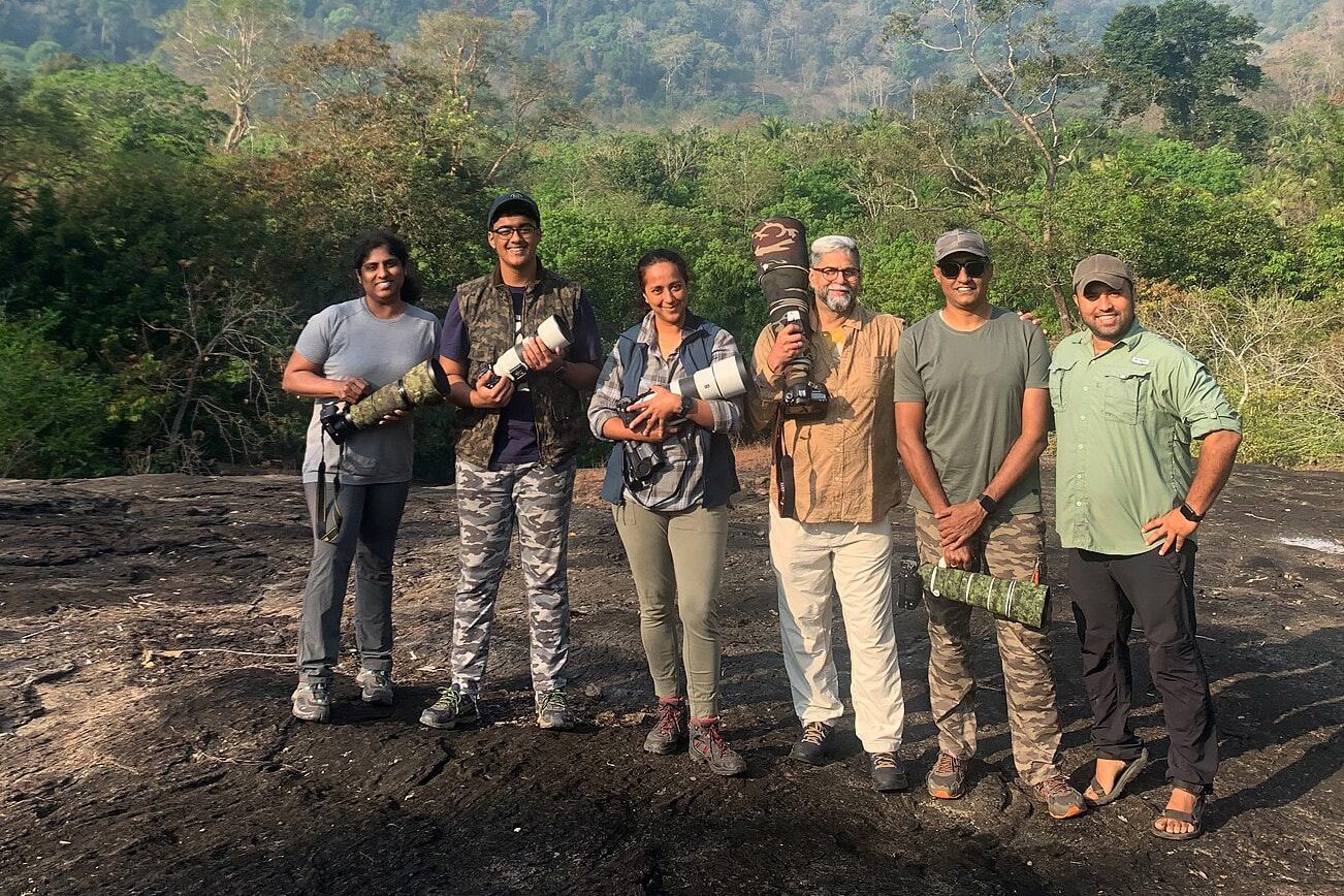 The Outback Experience team, geared up with long lenses, on a photography tour in Thattekad