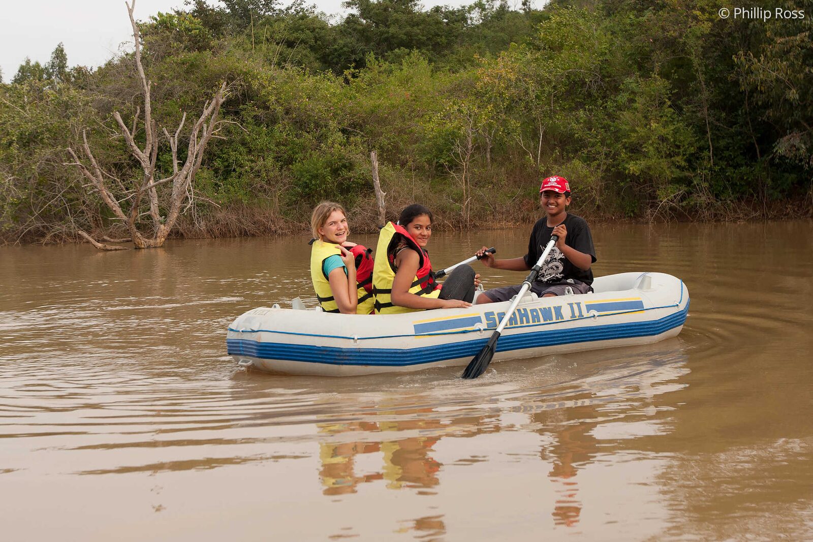 Kids enjoying a Boating experience to spot birds on our Kids Nature Camp